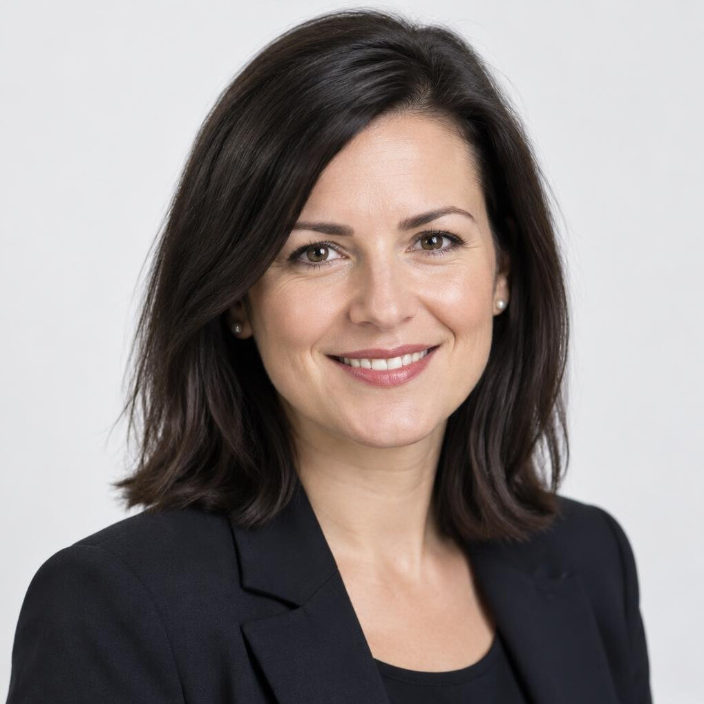 Professional portrait of a smiling businesswoman in a blazer